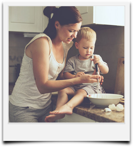 A mom and baby next to their quartz countertop in Portland, OR