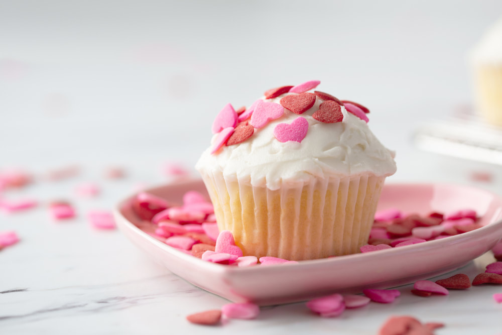 Cupcake with candy hearts on Marble countertop
